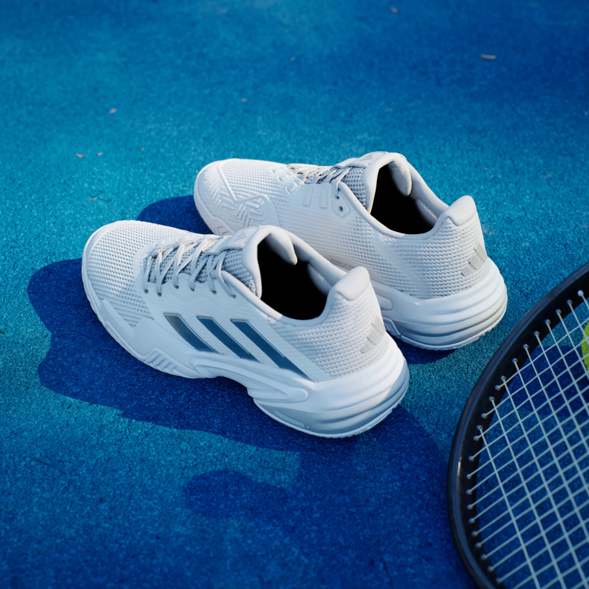 adidas Barricade 13 tennis shoe in white with Adituff toe protection and split herringbone Adiwear outsole