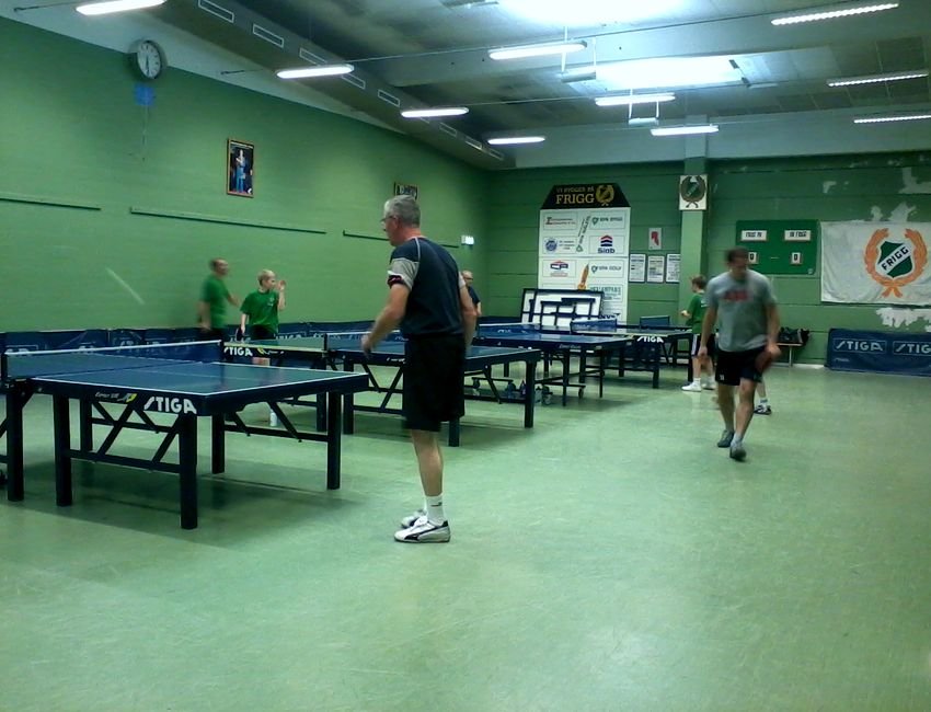 Club players competing in a table tennis match in a sports hall in Karlskrona
