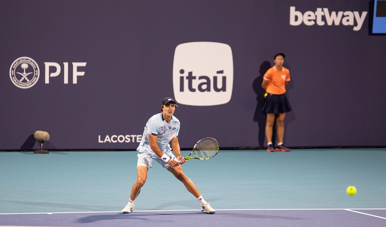 Professional tennis player in a low ready position on an outdoor hard court at the Miami Open
