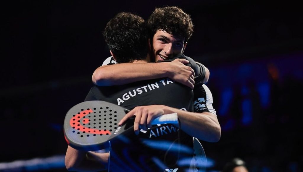 Agustín Tapia and Arturo Coello embracing on court, rackets in hand, after another Premier Padel title