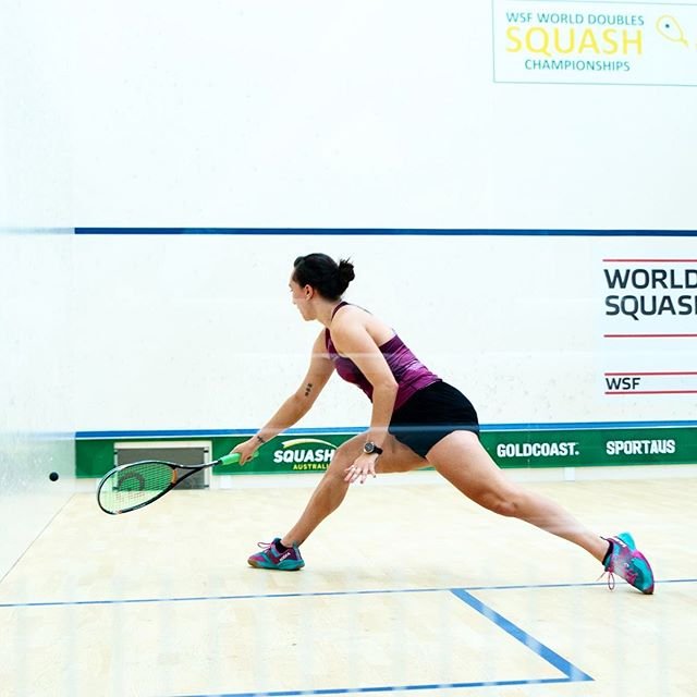 Player lunging into a forehand on the wide doubles court at the WSF World Doubles Squash Championships on the Gold Coast