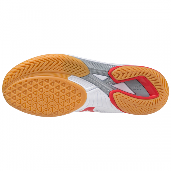 Table tennis shoe gum rubber outsole from below showing the fine tread pattern, pivot zones and diagonal flex groove